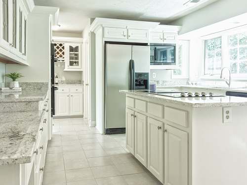 potomac falls white wooden kitchen cabinet near white wooden door va